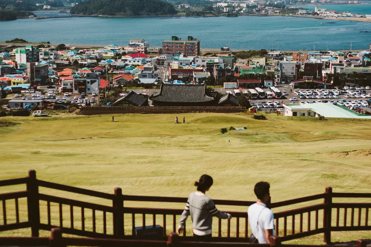 Beautiful cityscape from Jeju Island with vibrant rooftops and coastal views, perfect for travel imagery.